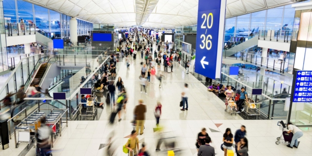 Blurred people walking in airport