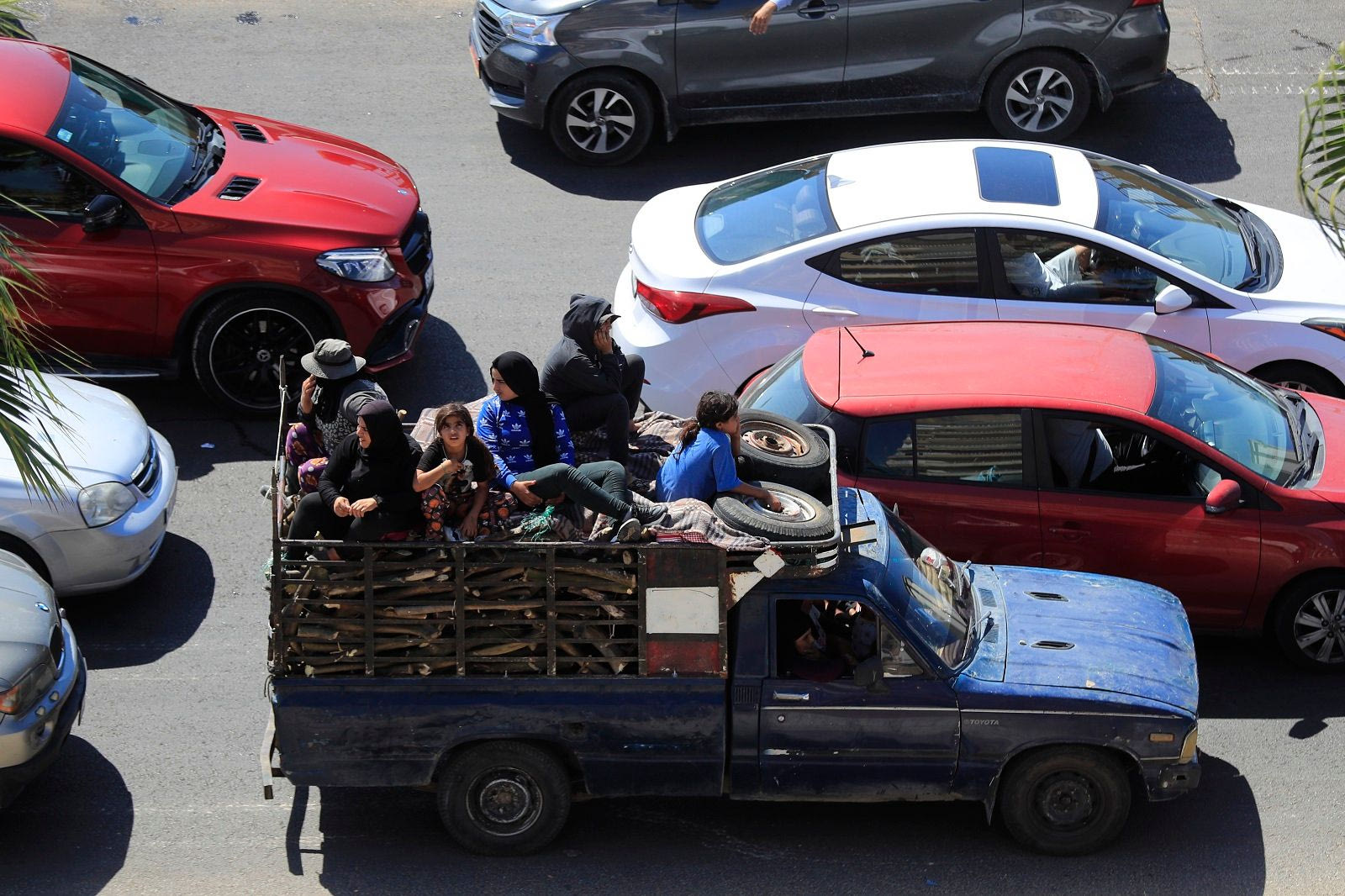 Cars are stuck in traffic jams as residents flee southern villages amid Israeli airstrikes.